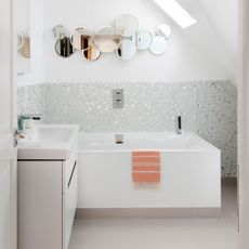 white attic bathroom idea with mirrored tiling