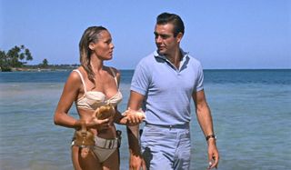 Dr. No Ursula Andress and Sean Connery walking on the beach