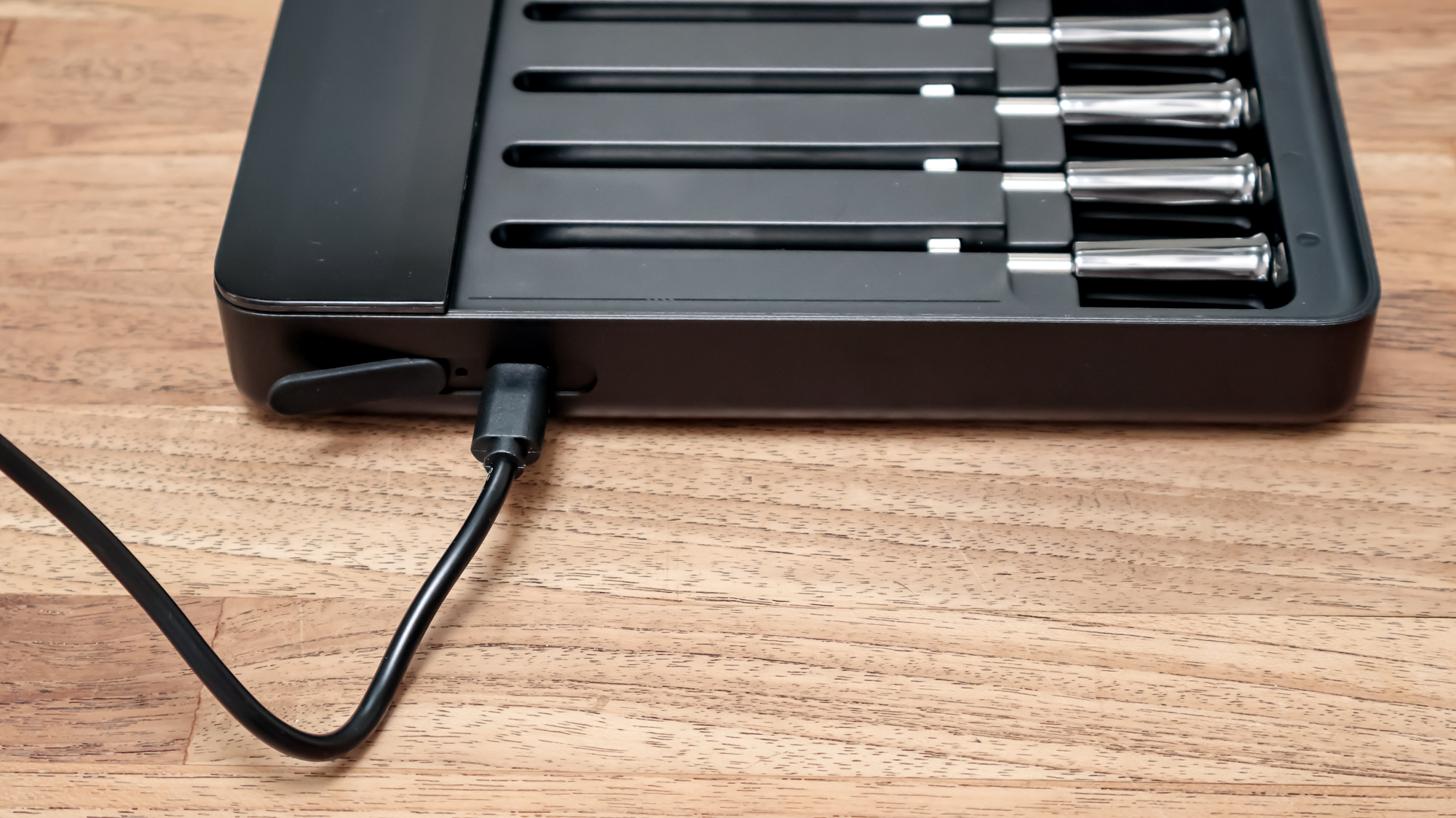 GoveeLife Smart Wireless Meat Thermometer on a kitchen surface charging