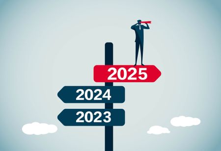 signpost pointing towards 2025 highlighted in red with 2024 and 2023 facing backwards.