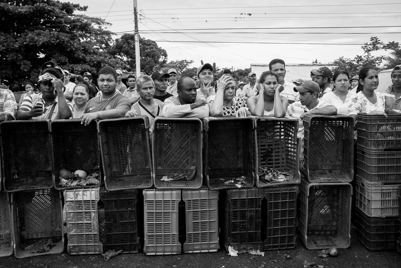 Venezuelans wait in line for food amid a crippling nationwide hunger crisis