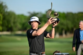 Peter Malnati holds the Valspar Championship trophy