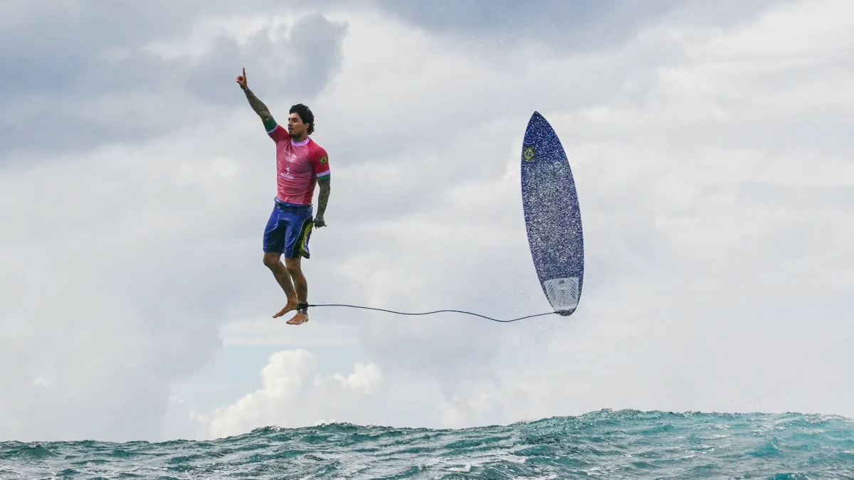 Viral photo of surfer Gabriel Medina next to a surfboard in the air at the 2024 Olympic Games