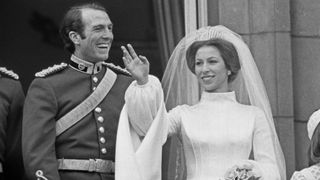 Princess Anne and Mark Phillips pose on the balcony of Buckingham Palace