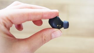 a close-up of one jabra elite 4 active earbud