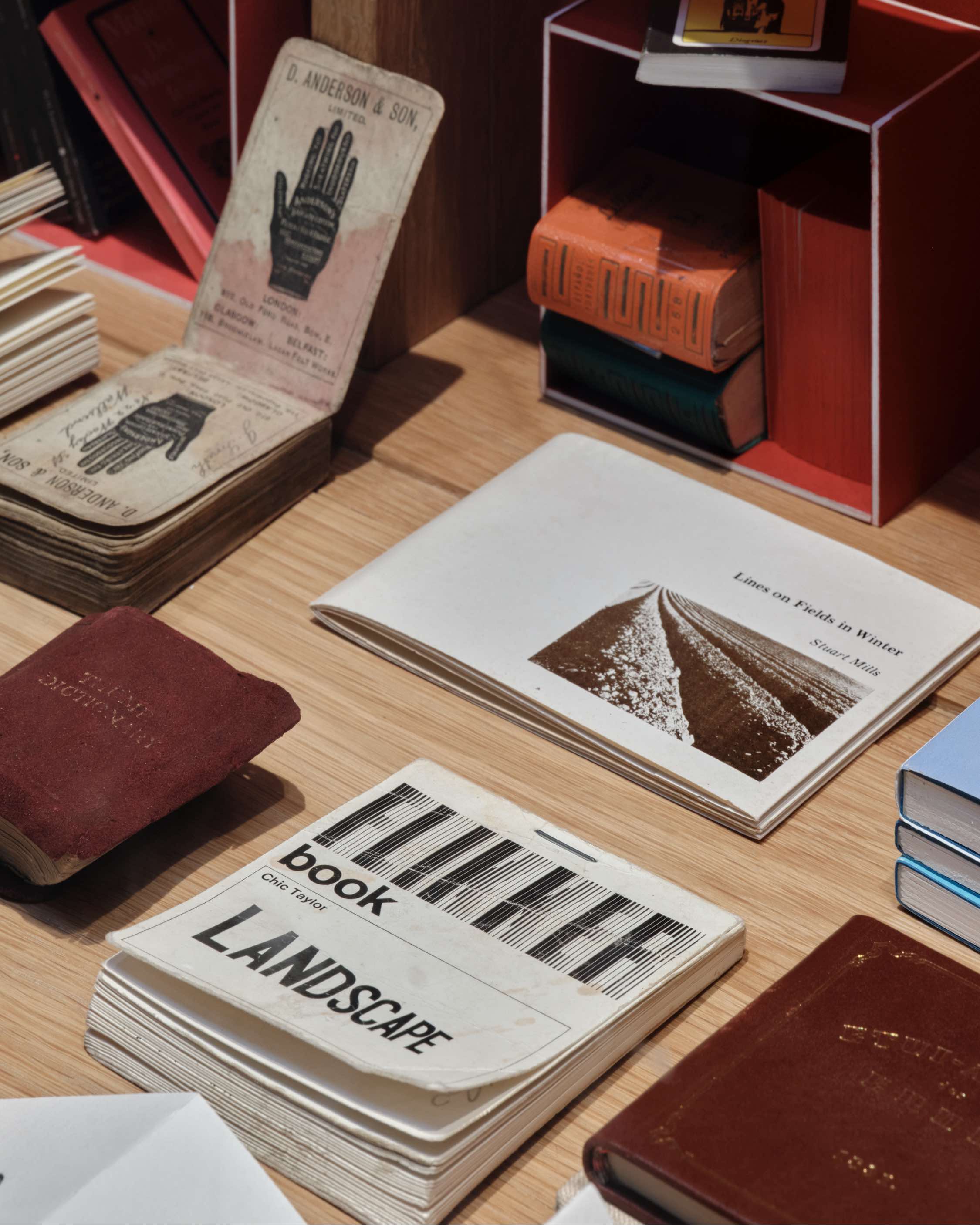 books arranged across exhibition space