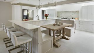 white family kitchen with banquette seating