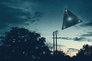 An illustration of a triangular UFO above powerlines.