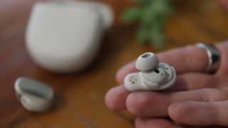 The Bose QuietComfort Ultra earbuds in white