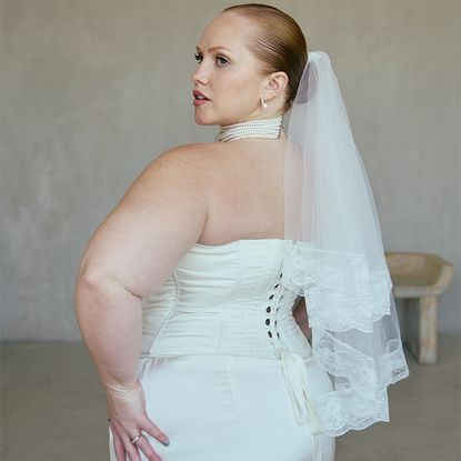 Models wear all white pieces from the collection. 