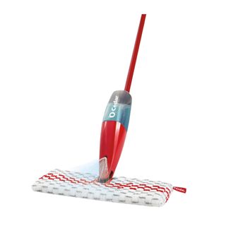 A red spray mop with a red base with water in it and a microfiber head with a blue, white, and red pattern