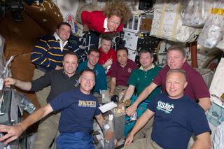 Seven astronauts dine aboard shuttle atlantis