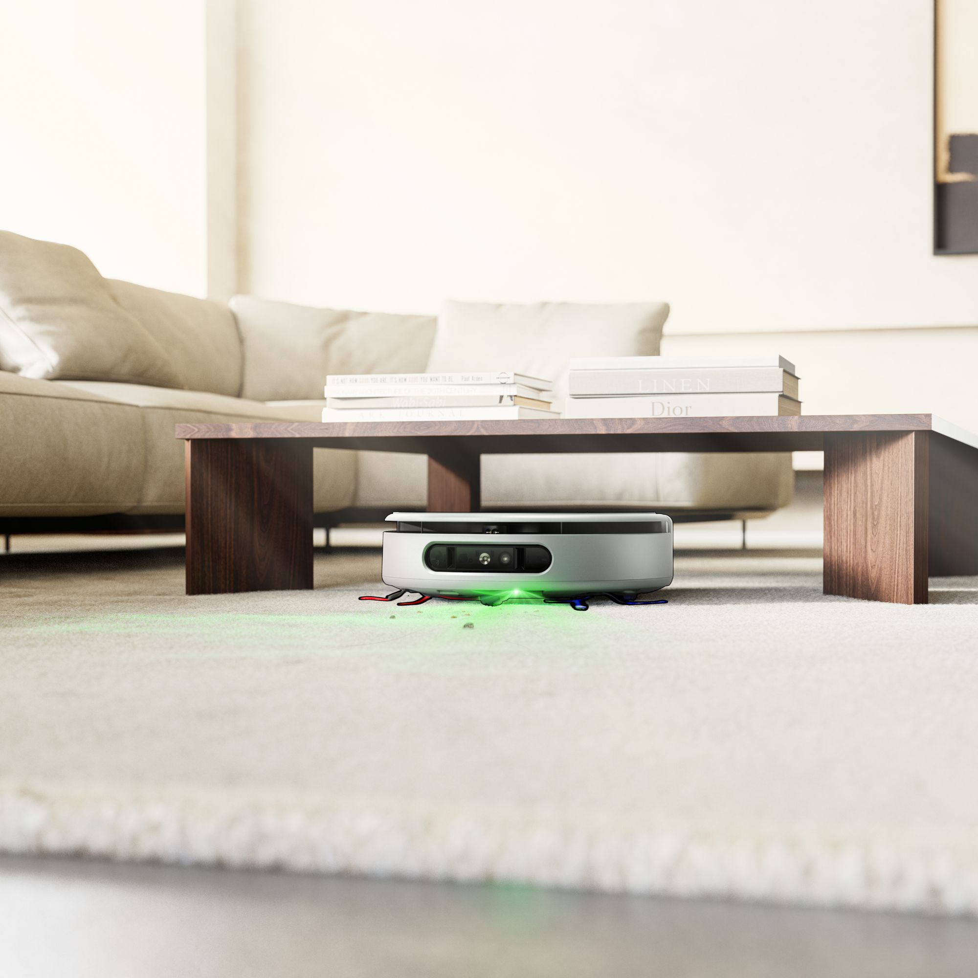 Dyson Nurovi robot vacuum cleaning under a coffee table in a living room