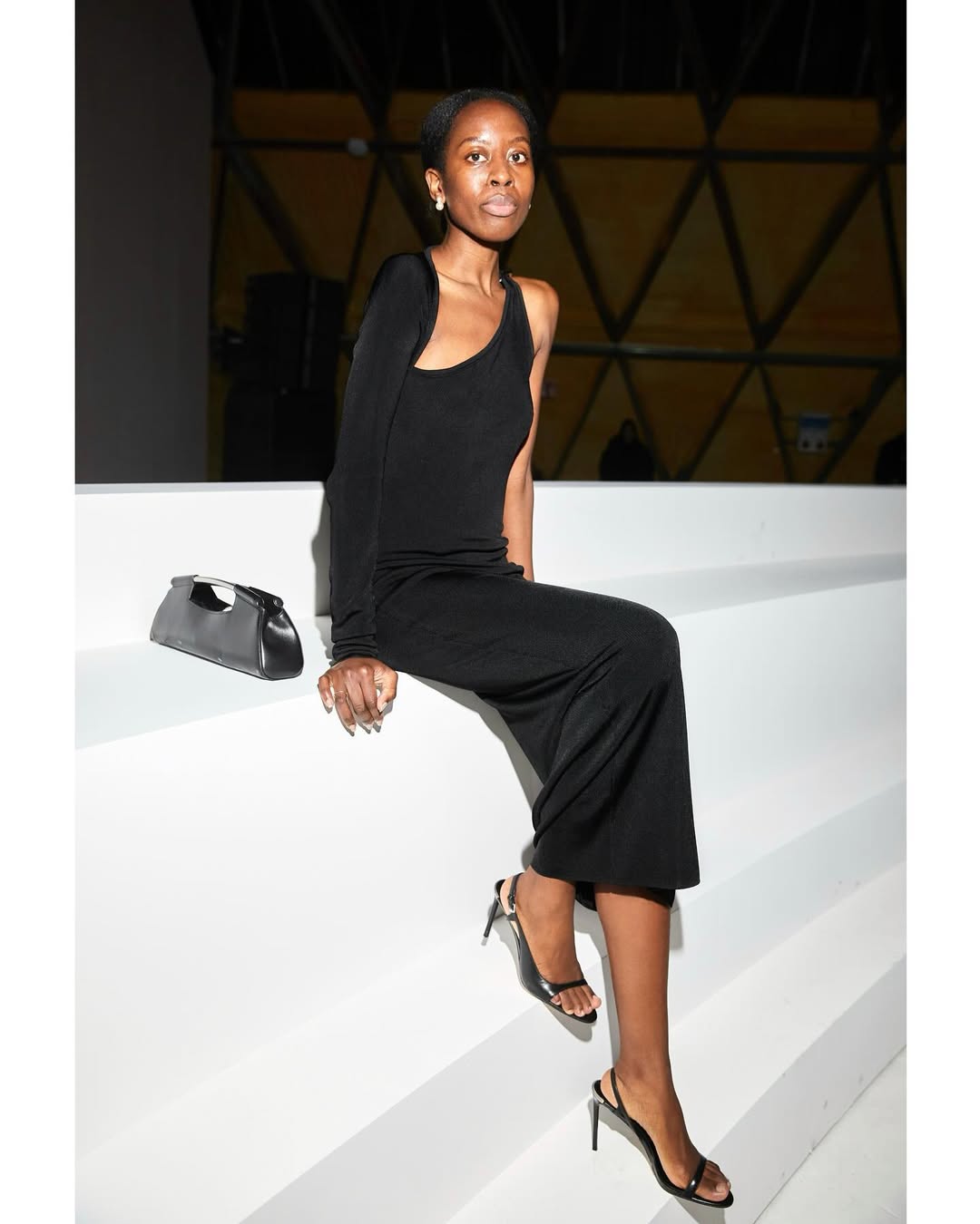 Sylvie Mus wears.a black dress