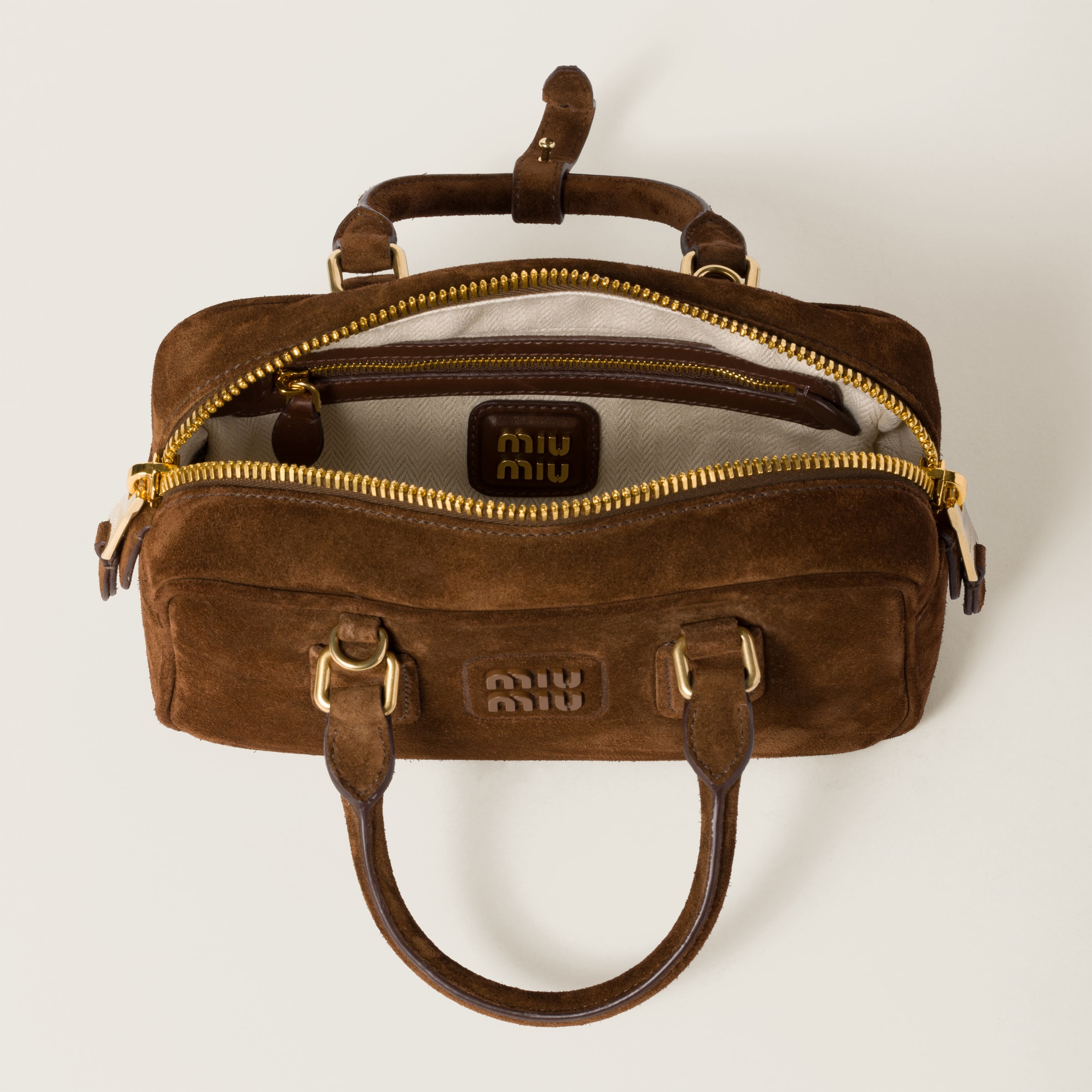 Arcadie padded suede top bag