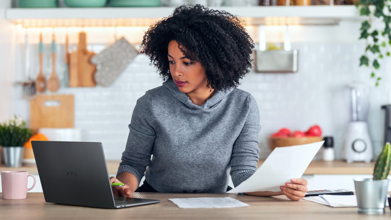 Dell XPS 14 2026 on a desk being used by a woman