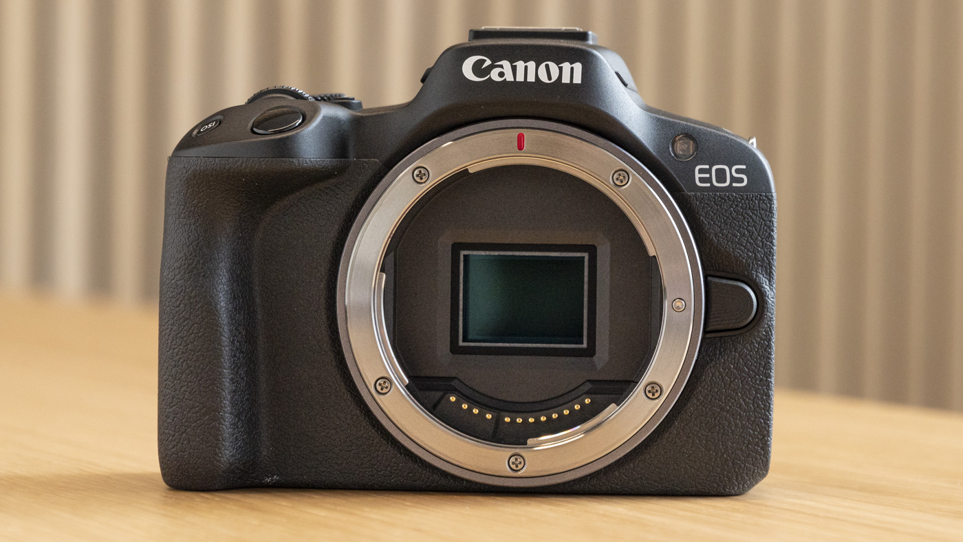 Canon EOS R50 on a table straight on front and no lens attached