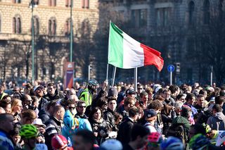 The Italian flag flies at the start of Milan-San Remo 