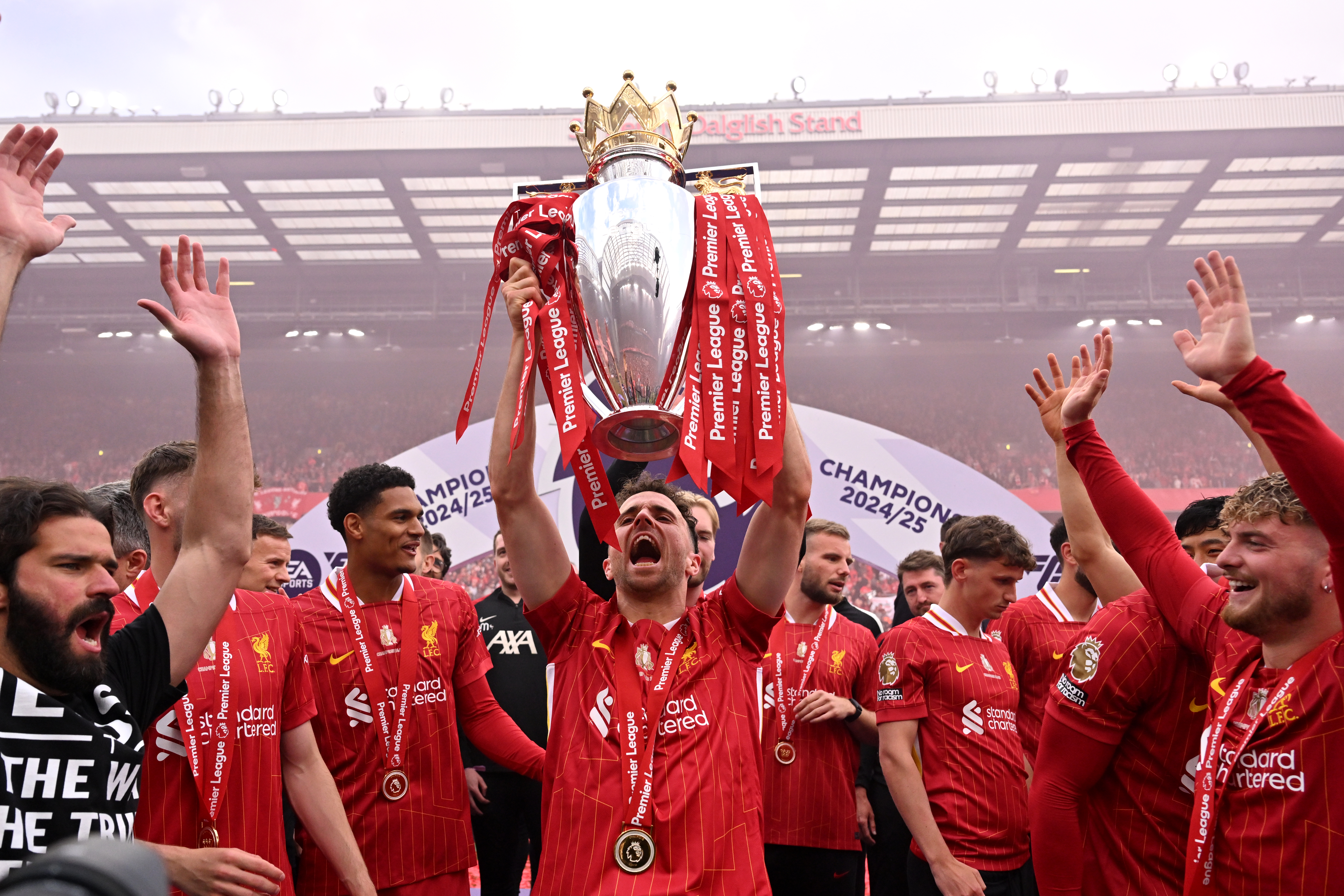 Diogo Jota of Liverpool celebrates with the Premier League trophy, as Liverpool are crowned the Champions of the Premier League for the 2024/25 Season, following the Premier League match between Liverpool FC and Crystal Palace FC at Anfield on May 25, 2025 in Liverpool, England.