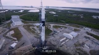 SpaceX's Falcon 9 rocket and Dragon cargo capsule stand poised to launch toward the International Space Station on July 24, 2019. The launch attempt was nixed because of bad weather.