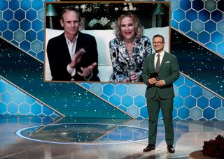 Bo Welch with Catherine O'Hara, Winner Best Television Actress – Musical/Comedy Series award for ‘Schitt's Creek’ via video; Christian Slater onstage at the 78th Annual Golden Globe Awards held at the Rainbow Room on Feb. 28, 2021