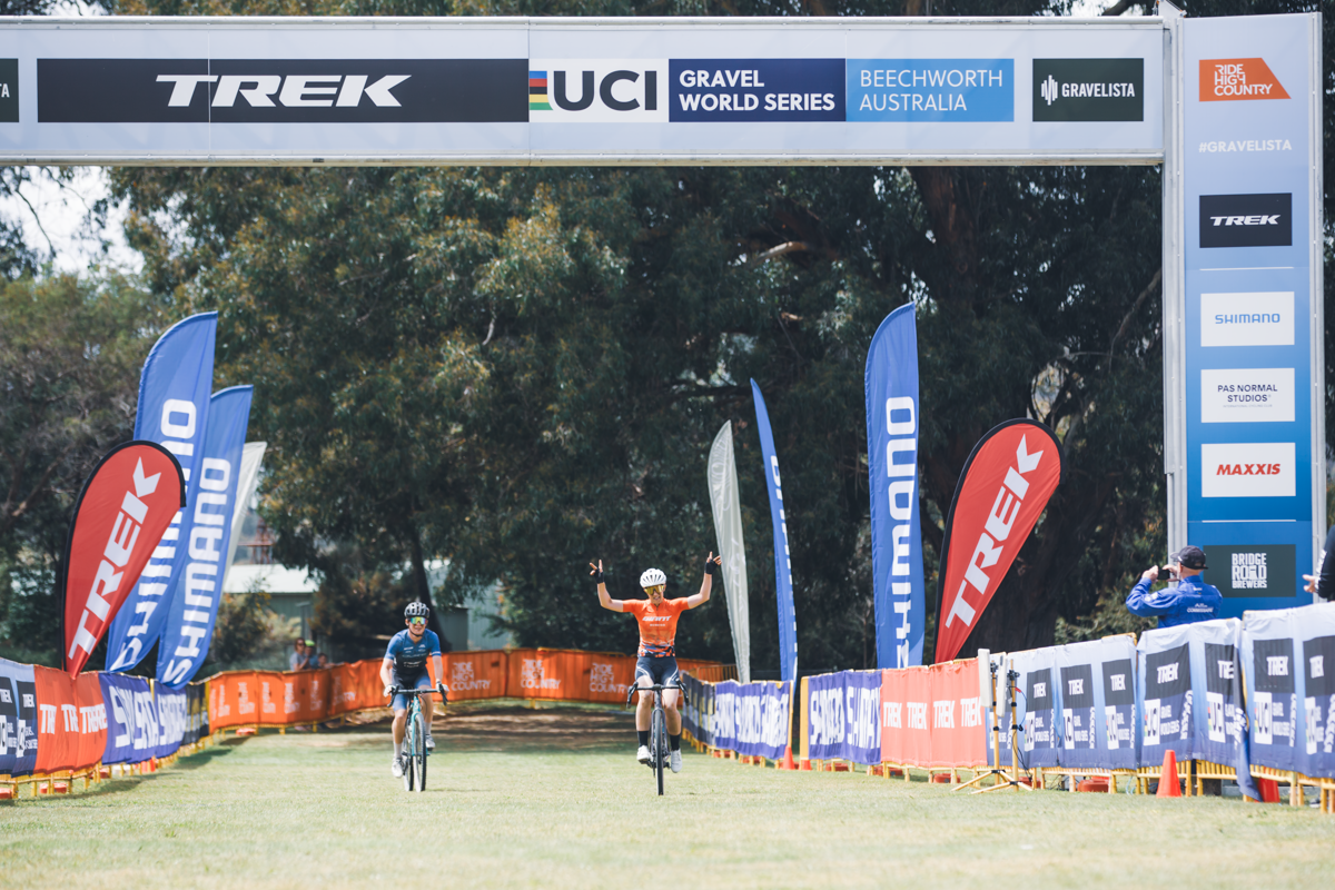 Courtney Sherwell celebrates victory at the Gravelista round of the UCI Gravel World Series race in Beechworth, 2023
