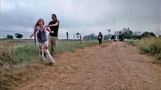 a girl running away from the leatherface house in The Texas Chainsaw Massacre