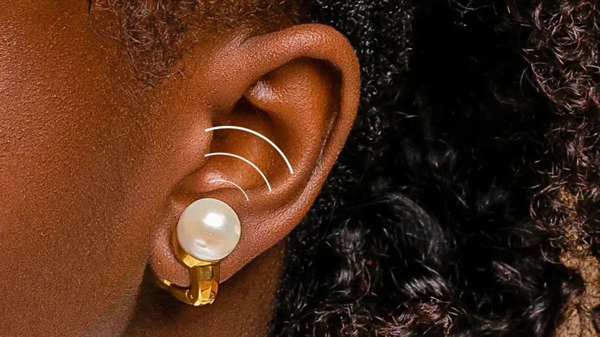 Nova H1 Audio Earrings being worn with lines drawn onto the image indicating the direction of the built-in speaker&#039;s audio.