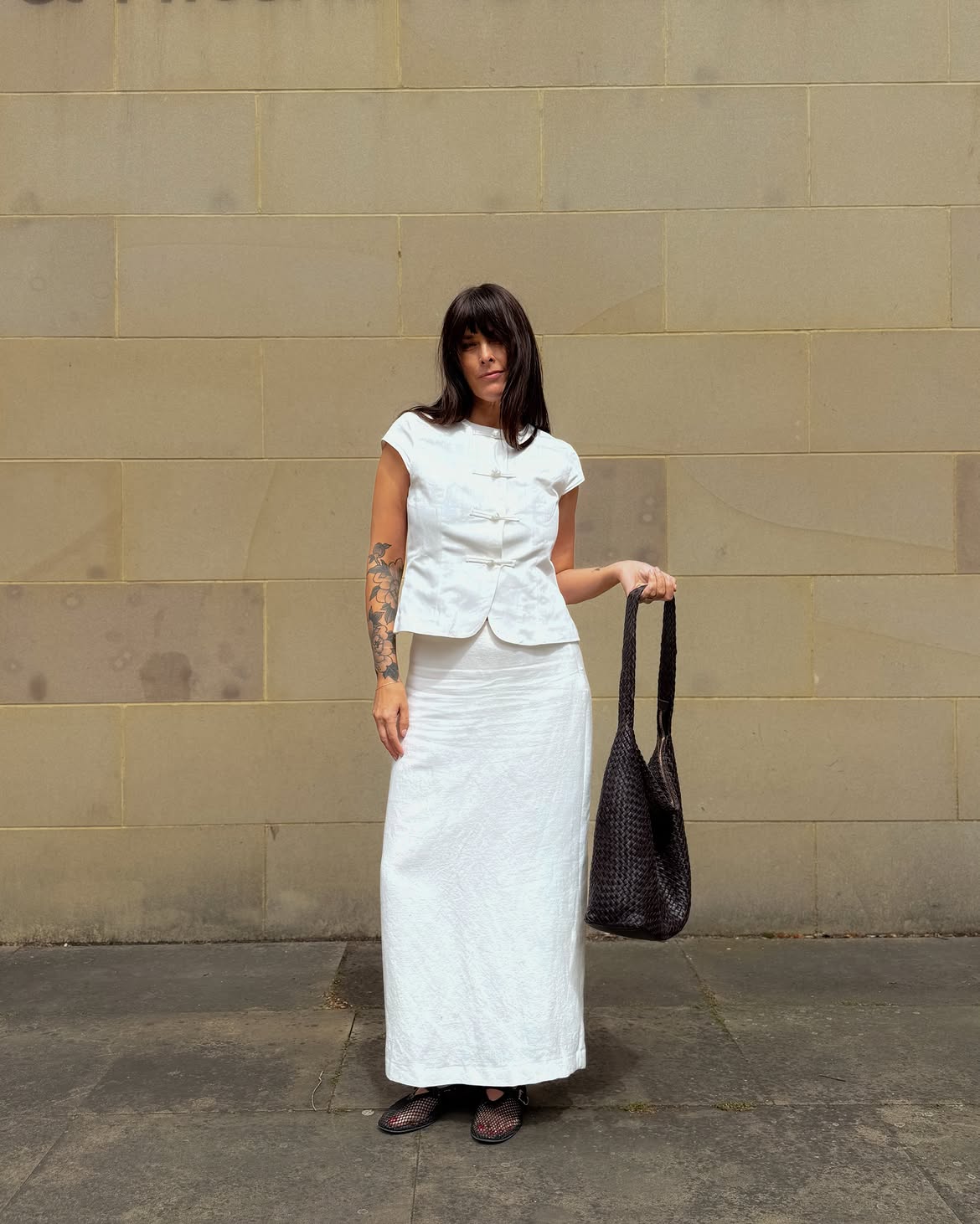 @annacascarina wears white skirt white top