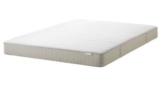 The IKEA Hasvåg Mattress shown with a cream base and white cover