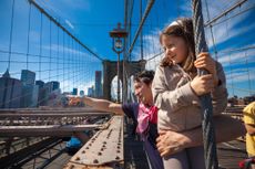Father and daughter over the brooklyn bridge