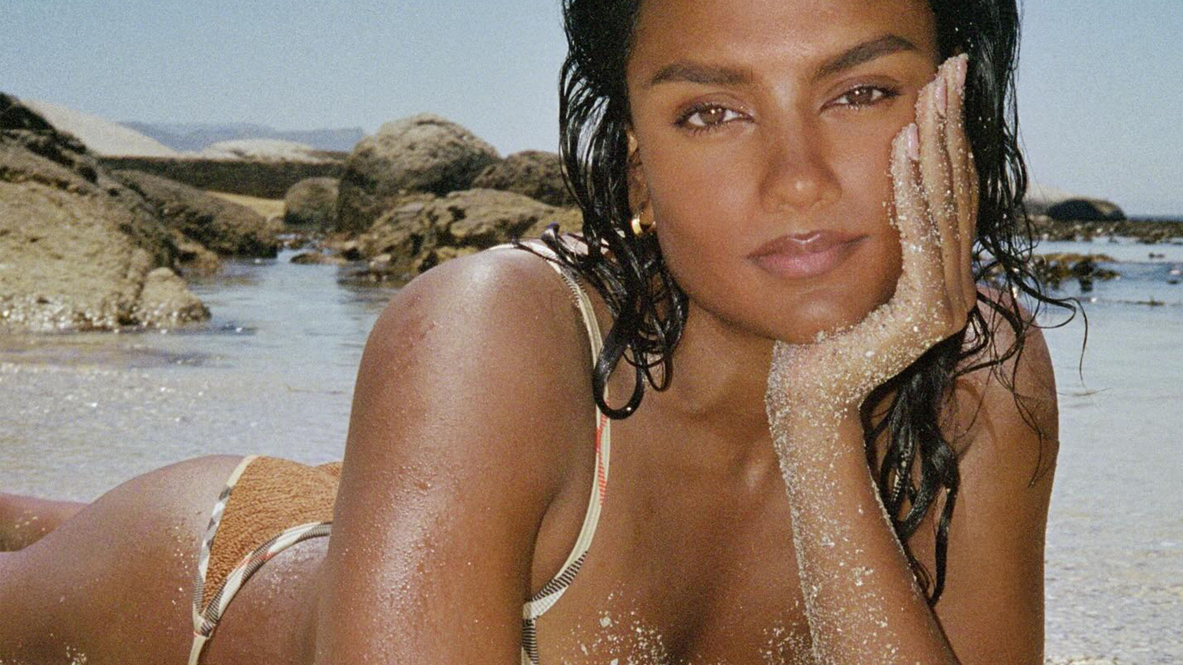 Simone Ashley wearing a Hunza G x Burberry swimsuit