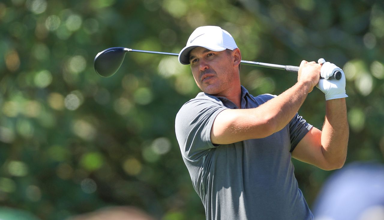 Brooks Koepka plays his tee shot on the fifth hole during the Masters.