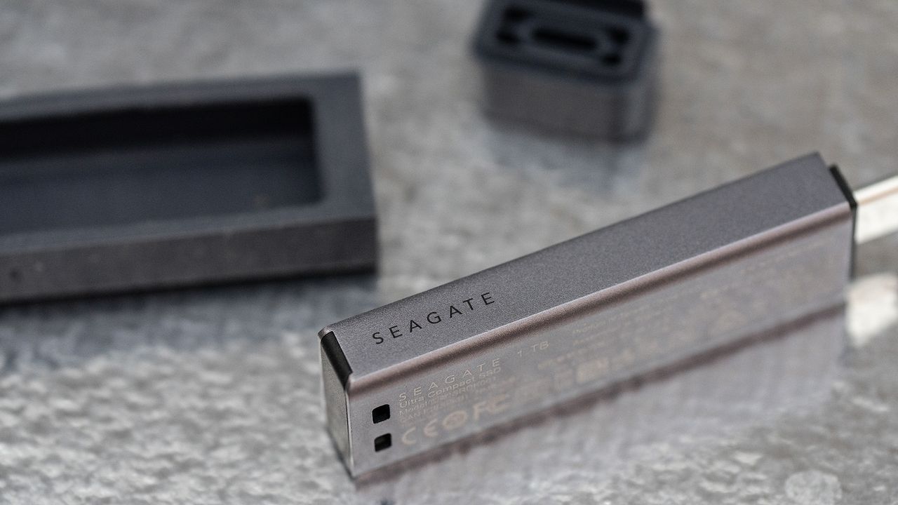Seagate Ultra Compact SSD on a glass background.