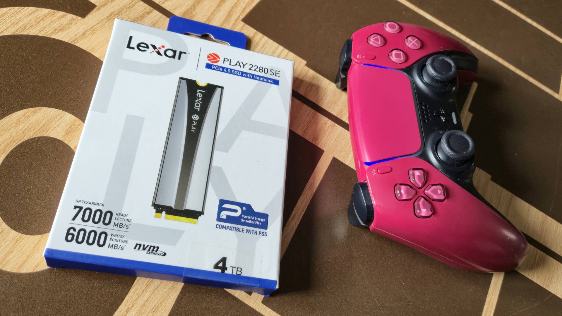 Photo by Rosalie Newcombe of the Lexar Play 2280 SE PCIe 4.0 PS5 SSD, sitting on a wooden coffee table.
