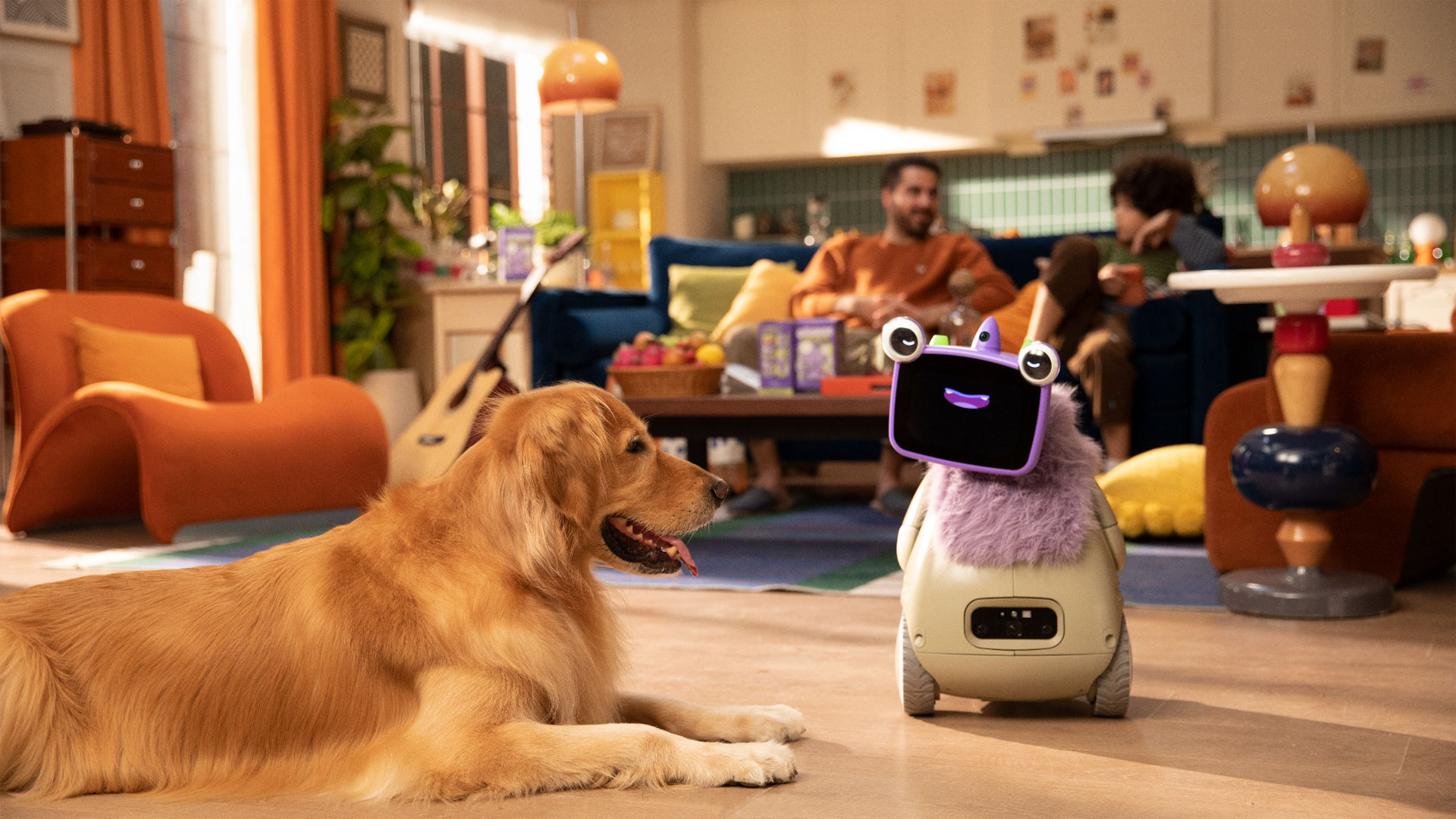 The OlloBot OlloNi SS1 in a living room with its family and pet dog