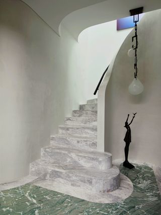 A staircase in marble flooring