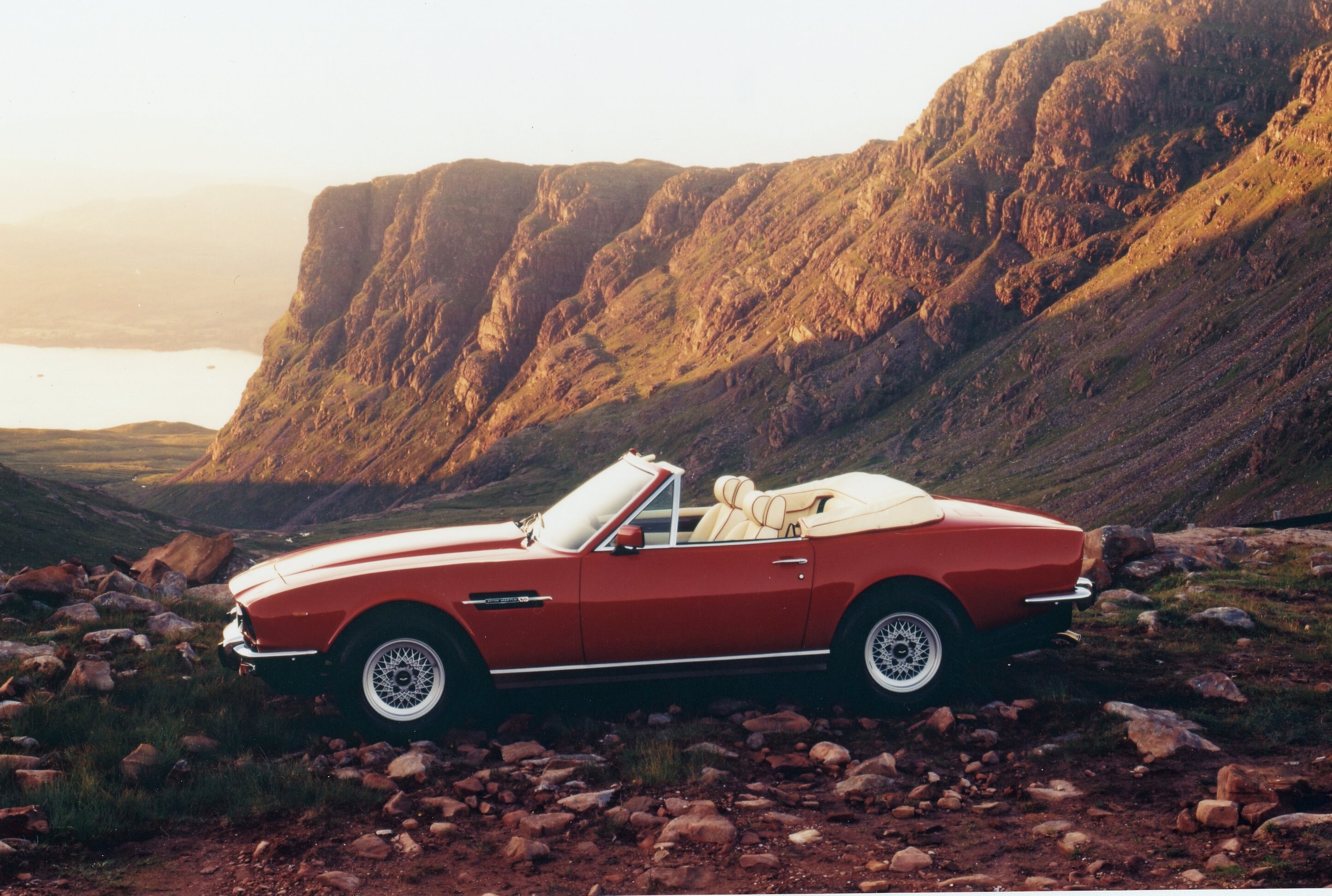 Details of the V8 Vantage Volante, showing the interiors, the engine and the front and rear of the car