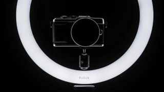 High contrast image of the Razer Ring Light, with a mirrorless camera mounted in the middle