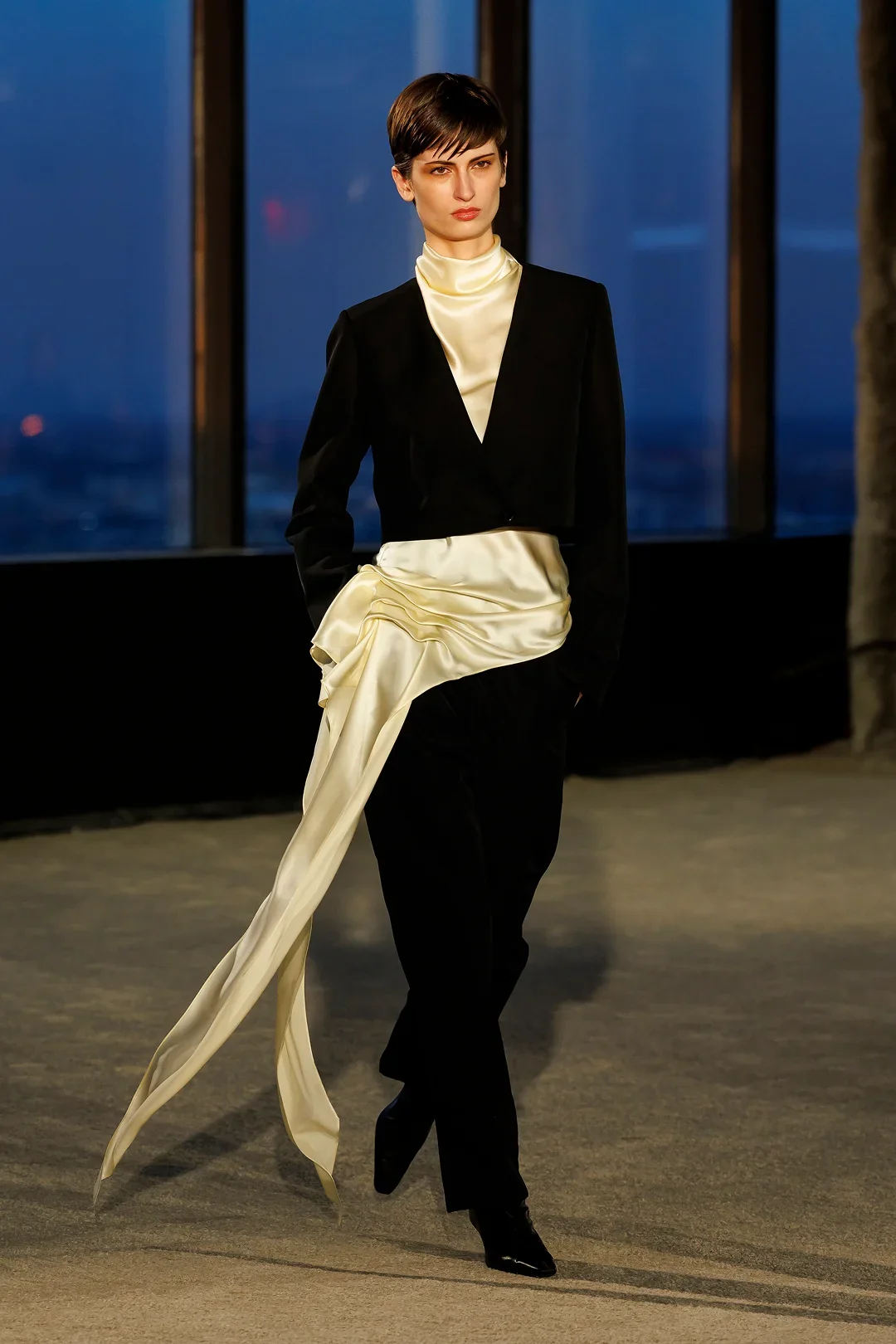 kallmeyer model wearing a lavish silk blouse on the runway