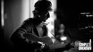 Timothée Chalamet as Bob Dylan with Gibson acoustics in a still from A Complete Unknown, the James Mangold biopic about the iconic singer-songwriter