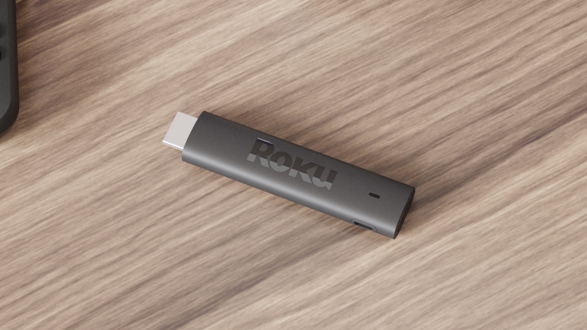 The Roku Streaming Stick 4K Plus on a table