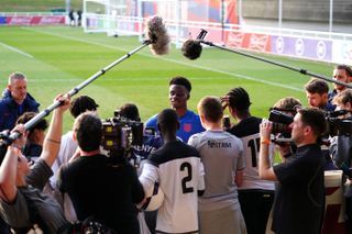 Bukayo Saka was interviewed during a training session at St George’s Park on Tuesday