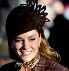 Princess Kate wearing a brown coat and hat on christmas 2025