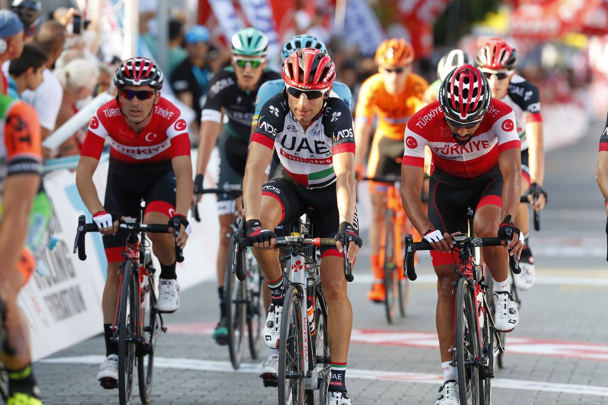 Diego Ulissi and others cross the line after being caught up in the late crash
