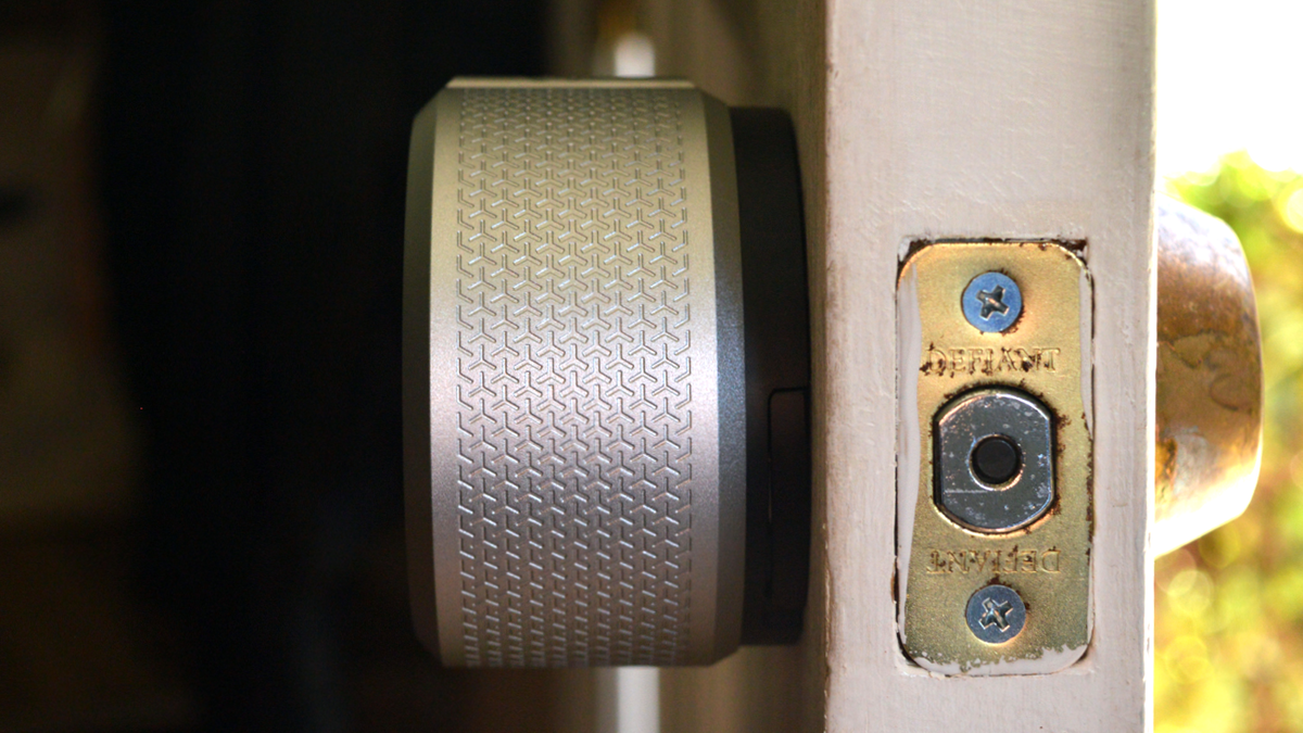 Side view of August Smart Lock Pro fitted on door