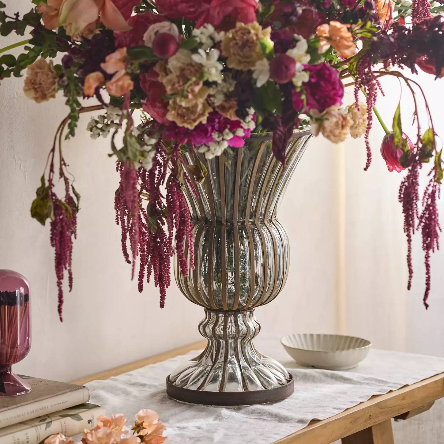 Glass vase with large floral arrangement