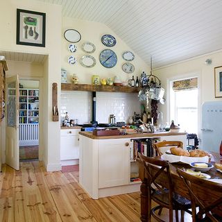 kitchen room with wooden flooring and photoframe on wall