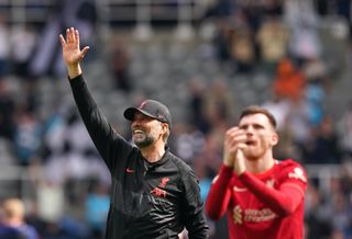 Liverpool manager Jurgen Klopp salutes the fans