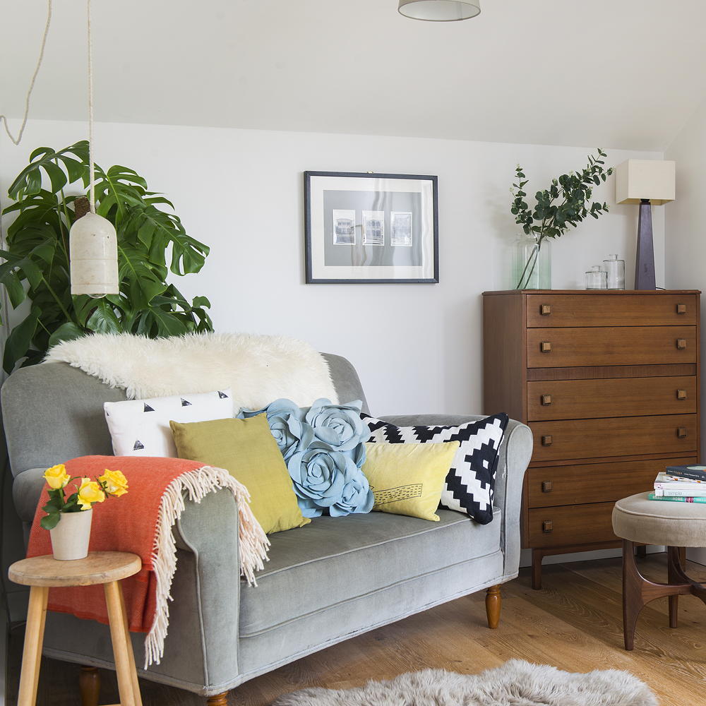 living room with bright white walls and sofaset